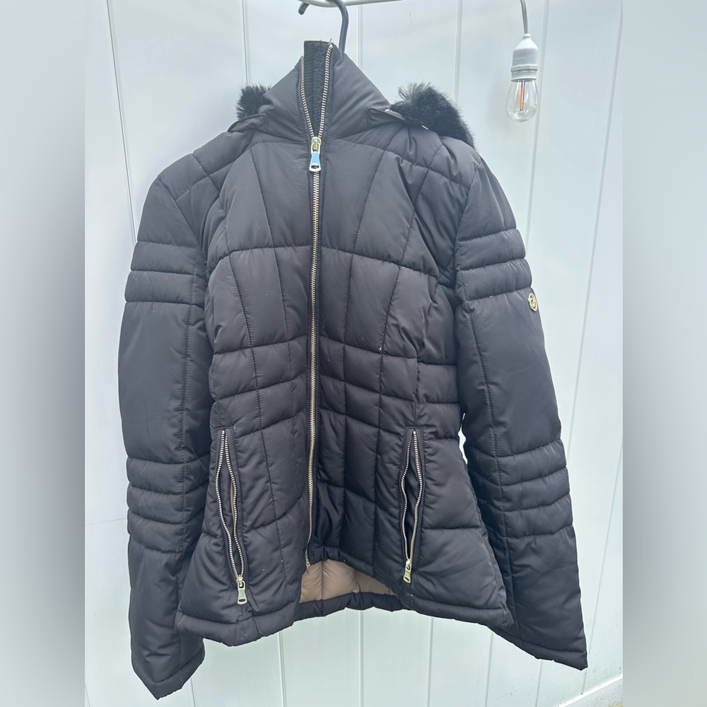 Calvin Klein size S black puffer jacket.